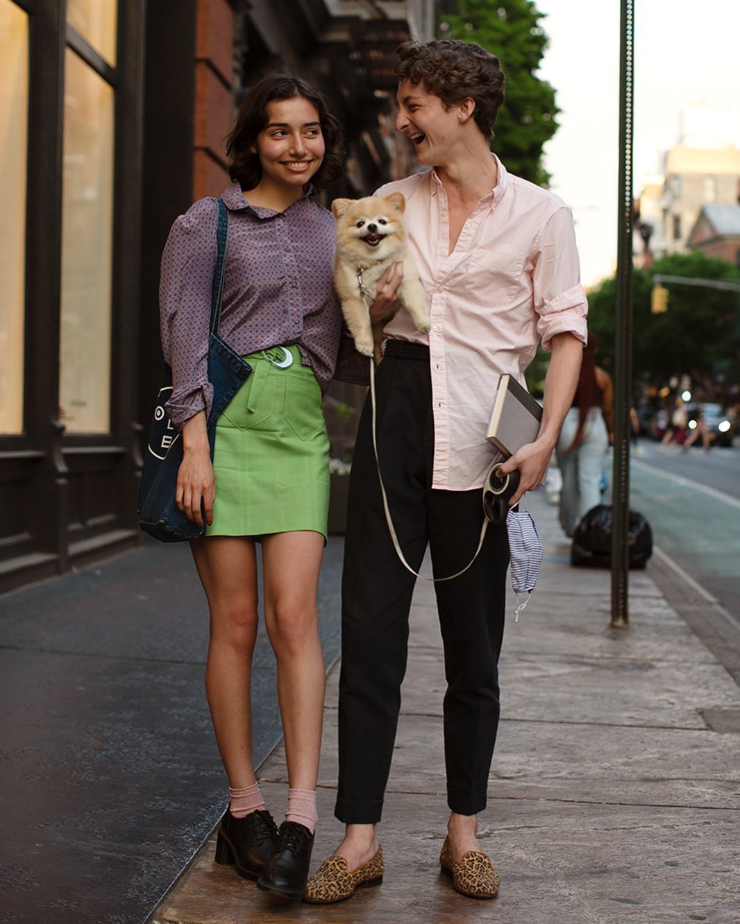 Two sidewalk looks pair a patterned blouse and lime mini skirt with a pale pink shirt, cropped black trousers, and leopard loafers.