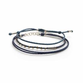 dark blue stacked cord and metal bracelets